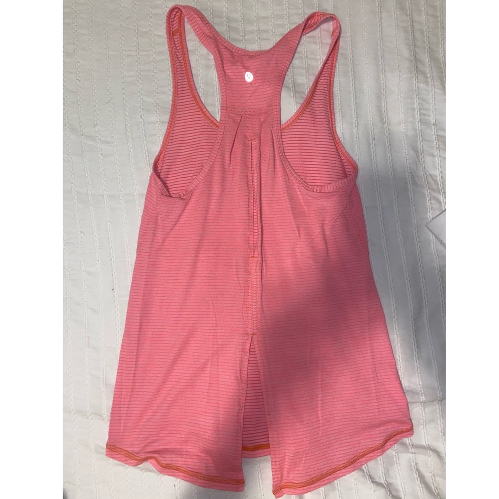 Lululemon racerback tank top on bright peach